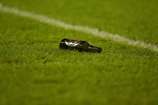 Bottle on the pitch at the New Den