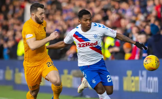 Livingston's Craig Halkett (left) chases down Rangers' Alfredo Morelos