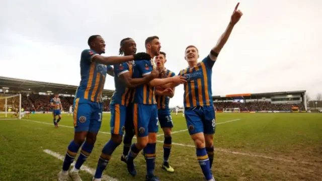 Shrewsbury Town celebrate scoring their second goal against Wolves at the weekend