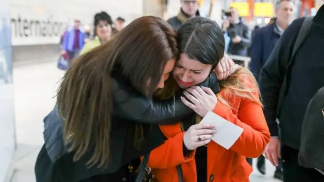 Laura Plummer (right) is embraced by her sister Rachel at Heathrow Airport following her return to the UK after being released from a prison sentence in Egypt