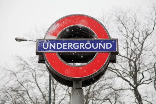 Snow covered Underground sign