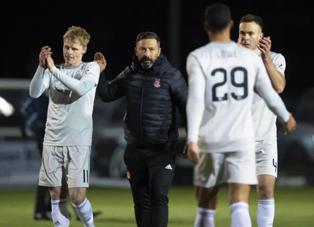 Aberdeen manager Derek McInnes congratulates his players