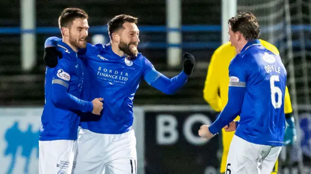 Stephen Dobbie (centre) celebrates scoring against Dundee