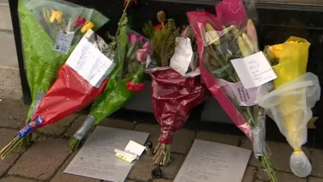 Floral tributes have been left on Worcester Road in Malvern