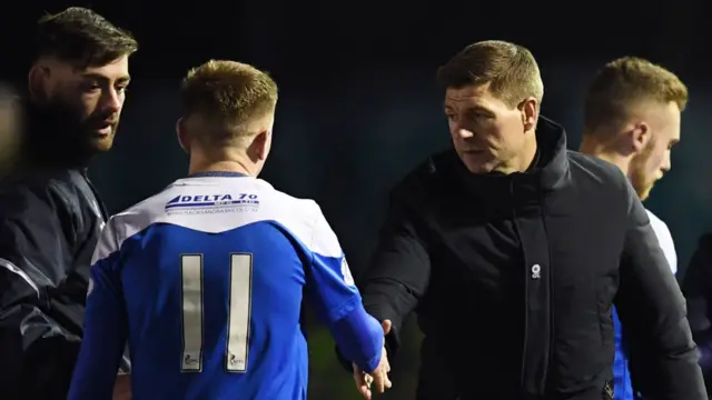 Cowdenbeath's Robbie Buchanan shakes hands with Rangers' Steven Gerrard