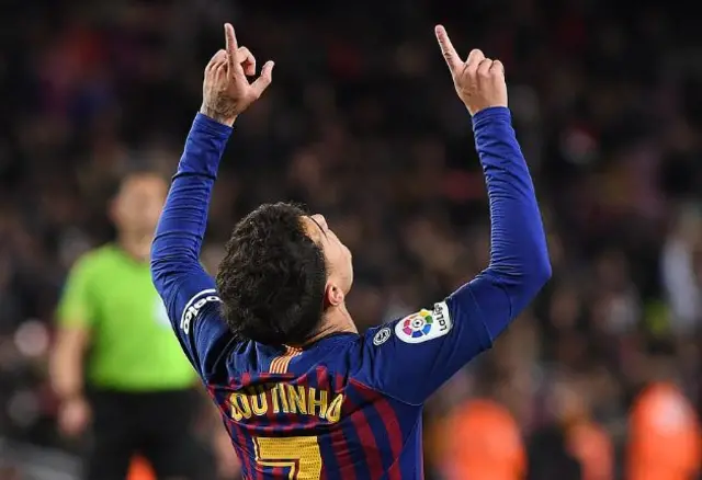 Philippe Coutinho celebrates scoring a penalty