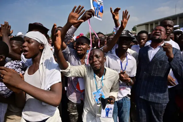 Supporters of newly inaugurated Democratic Republic of the Congo's President Felix Tshisekedi react after Tshisekedi