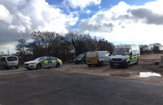 Police officers at building site