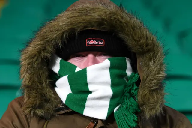 A Celtic fan wrapped up in a scarf