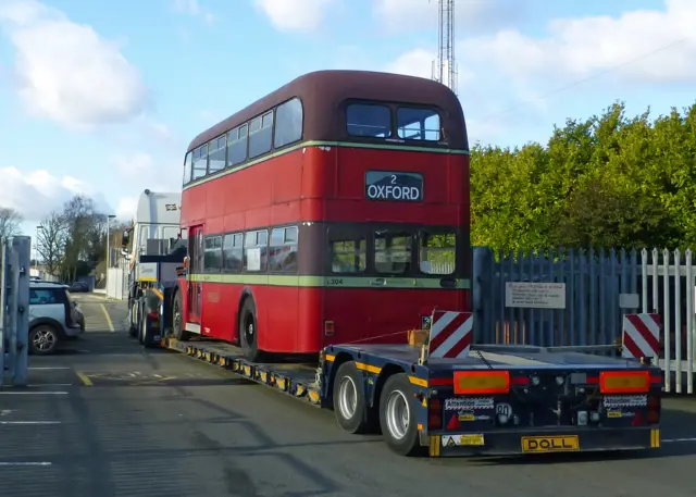 Oxford Bus Company bus on low loader