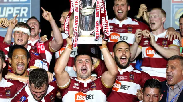 Wigan Warriors lift the Super League trophy