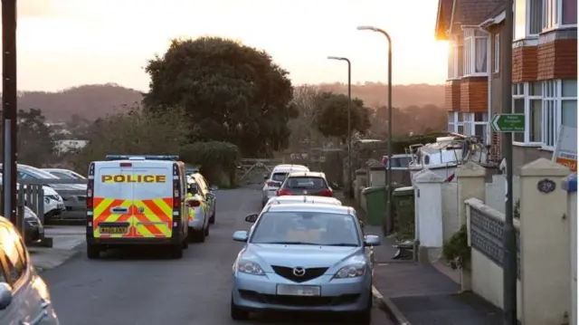 police cars parked on residential street