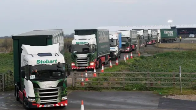 Lorries leaving Manston, Eddie Stobart at front