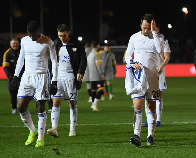 Leicester City players leave pitch