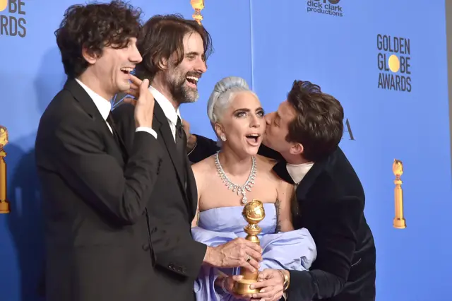Lady Gaga, Mark Ronson (r) and co after Golden Globes win