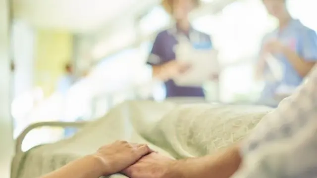 Patient in hospital bed