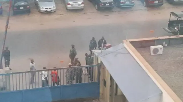 Soldiers seen by the gates at the offices of Daily Trust in Abuja