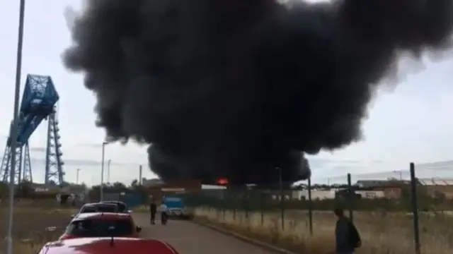 Plume of black smoke near the Middlesbrough Transporter Bridge