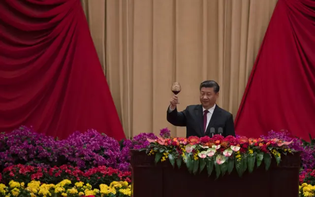 Xi Jinping raises a toast at an anniversary celebration event