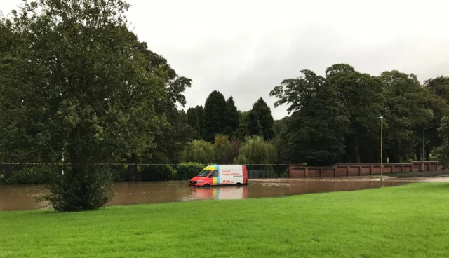 Van stuck in floodwater