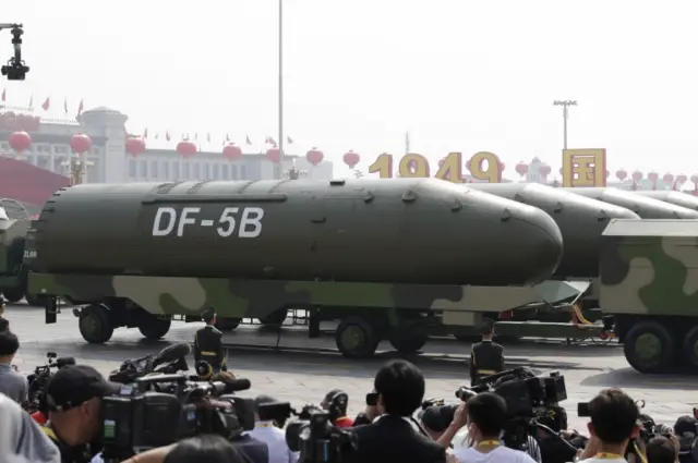 Military vehicles carrying DF-5B intercontinental ballistic missiles