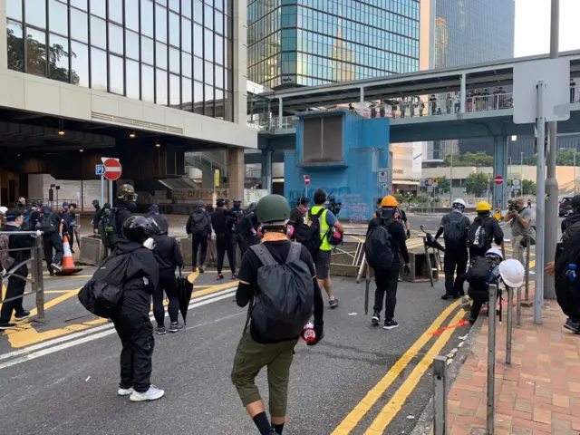 Protesters build a barricade in Admiralty