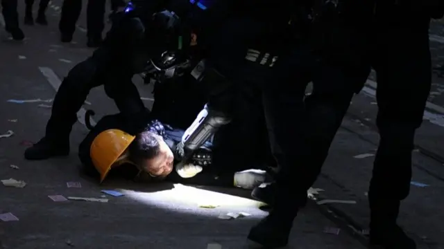 Police detain a protester in Hong Kong on October 1, 2019