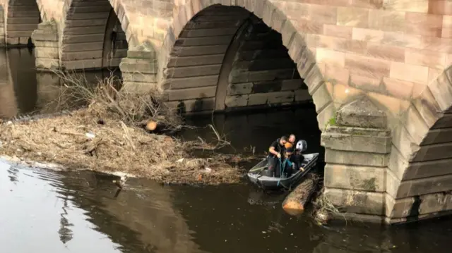 Boat under bridge