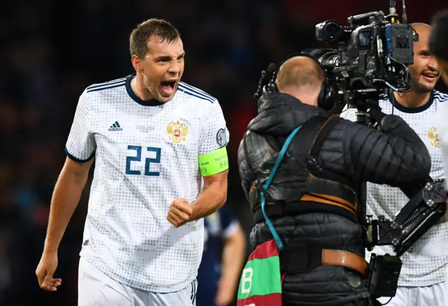 Russia captain Artem Dzyuba celebrates his equalising goal at Hampden