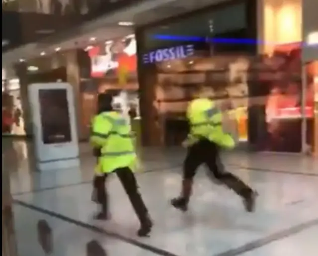 Police officers running