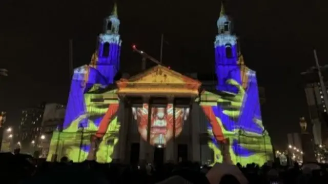 Telekinetic Rumours projected onto the stonework of Leeds Civic Hall