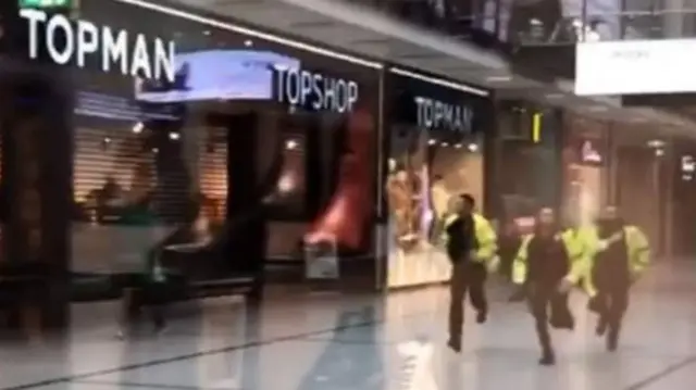 Police were seen running through the Arndale Centre