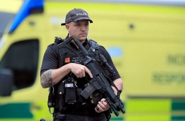 Armed police in Manchester city centre