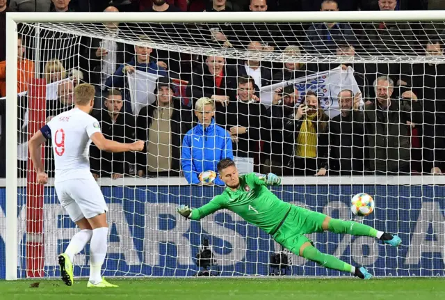 Harry Kane (L) shoots a penalty to score the 0-1 against Czech Republic"s goalkeeper Tomas Vaclik during the UEFA Euro 2020 qualifier Group A football match Czech Republic v England at the Sinobo Arena in Prague