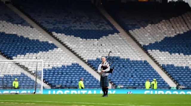 A lone piper on the Hampden pitch