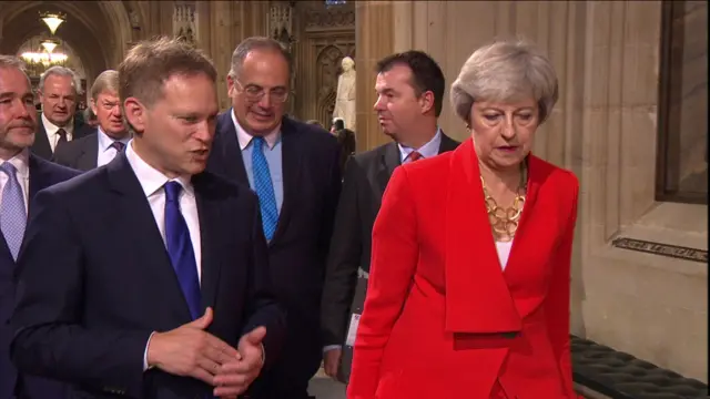 Theresa May walks back to the Commons with Transport Secretary Grant Shapps