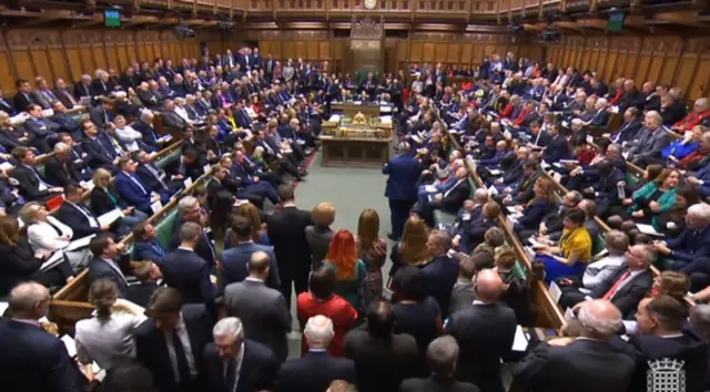 A grab from a handout video made available by the UK Parliamentary Recording Unit shows a general view of MPs during a debate at the House of Commons