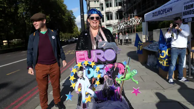 An anti-Brexit demonstrator pushes a "Euro Disco trolley" as Parliament sits on a Saturday for the first time since the 1982 Falklands War, to discuss Brexit in London, Britain