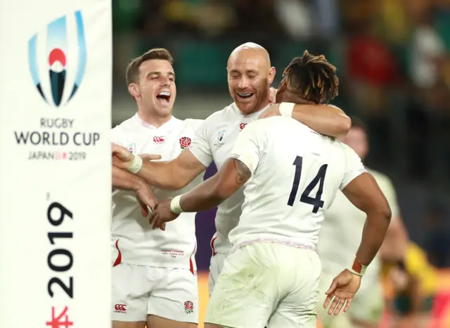 Anthony Watson of England celebrates scoring his team"s fourth try with Willi Heinz and George Ford during the Rugby World Cup 2019 Quarter Final match between England and Australia at Oita Stadium