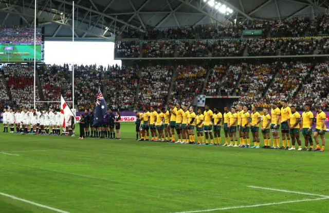 England and Australia observe a silence for those who lost their lives following Typhoon Hagibis prior to the Rugby World Cup 2019 Quarter Final match between England and Australia at Oita Stadium