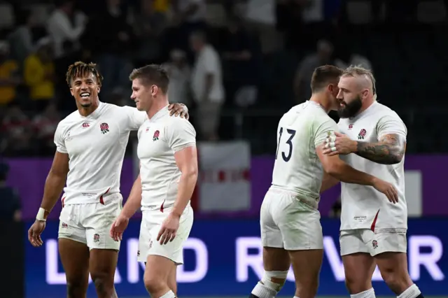 England's players celebrate after winning the Japan 2019 Rugby World Cup quarter-final match between England and Australia at the Oita Stadium in Oita