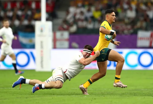 Jordan Petaia of Australia is tackled by Tom Curry of England during the Rugby World Cup 2019 Quarter Final match between England and Australia at Oita Stadium