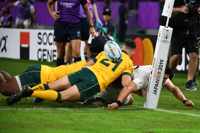 England's scrum-half Ben Youngs (R) loses control of the ball during the Japan 2019 Rugby World Cup quarter-final match between England and Australia at the Oita Stadium in Oita