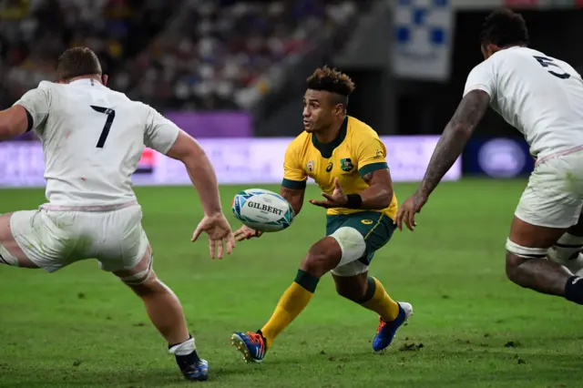 Australia's scrum-half Will Genia catches the ball during the Japan 2019 Rugby World Cup quarter-final match between England and Australia at the Oita Stadium