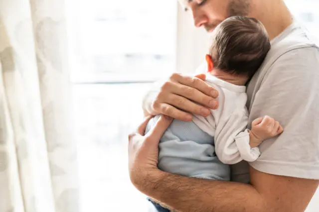 Stock pic of father with baby