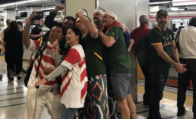 Japan and South Africa fans take a selfie together