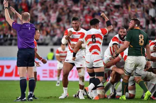 Japan cheer a penalty