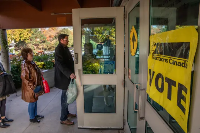 People line up to vote at a polling station at Trinity Community Rec Center for Canada's 43rd general election October 21, 2019 in Toronto, Ontario, Canada. Liberal party leader Justin Trudeau is neck and neck with Conservative Leader Andrew Scheer, as they both attempt to be elected the country's Prime Minister.