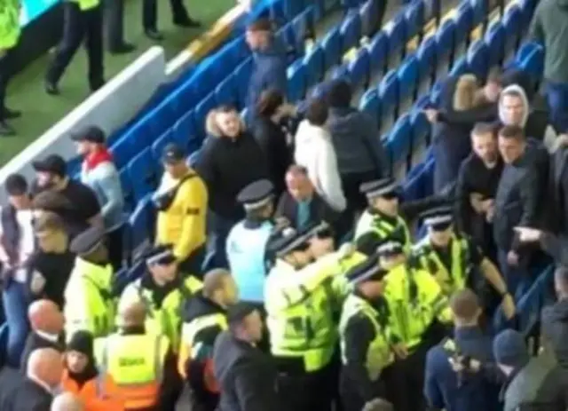 Supporters clash with police inside the ground