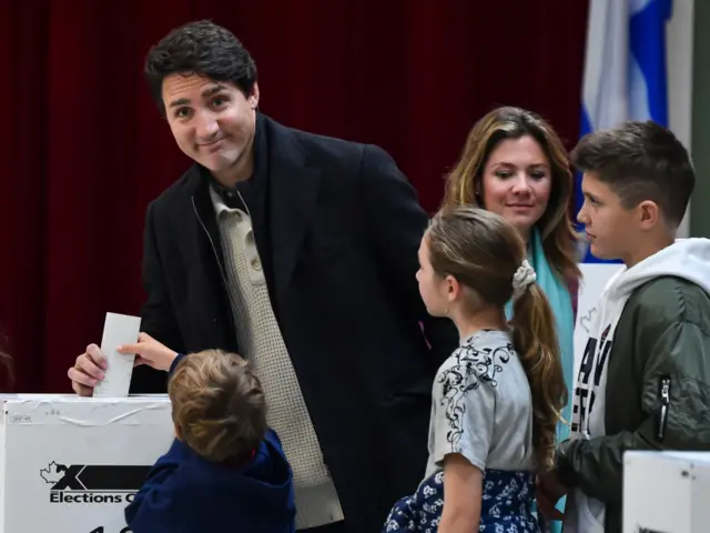 Canadian Prime Minister Justin Trudeau is surrounded by his family as he casts his vote on election day at a polling station on October 21, 2019 in Montreal, Canada. Trudeau's Liberals and Andrew Scheer's Conservatives are in a close race in the federal election, possibly leading to a minority government if neither candidate gets the 170 seats needed to form a majority.